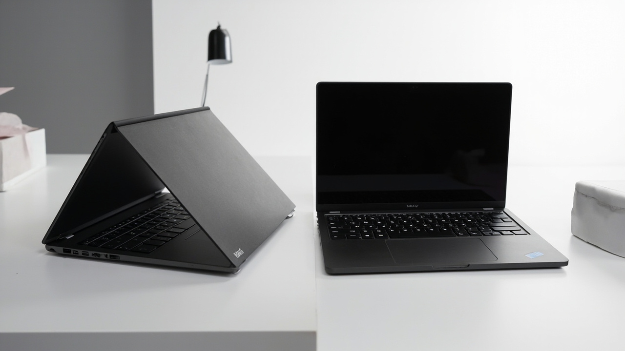 Close-up of laptop keyboards and trackpads side by side